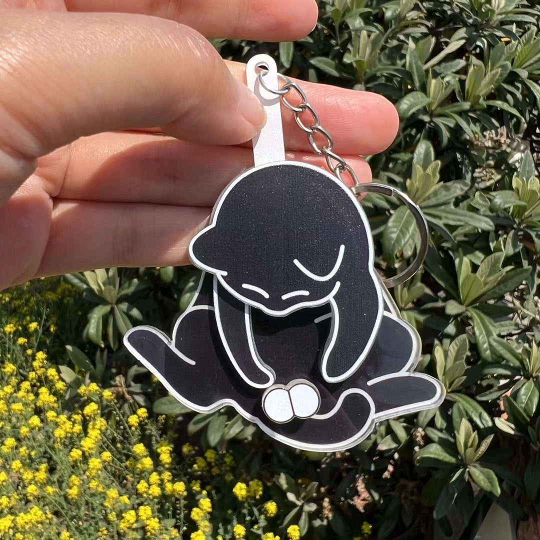 Playing with eggs and kitten keychain